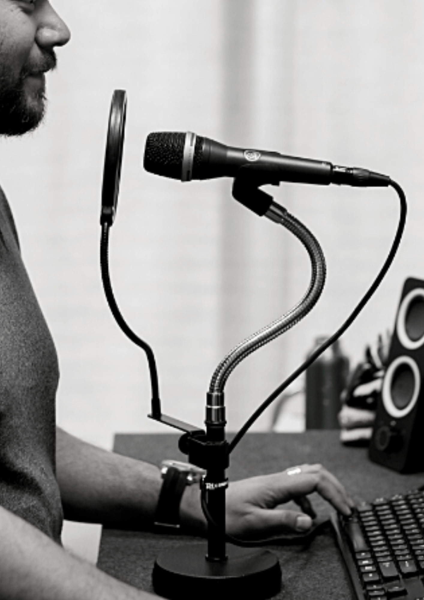 Person standing in front of an audio describing microphone