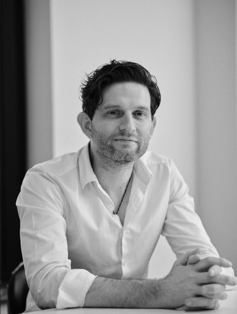 A black-and-white photo of Able's CEO, Dan Buckingham